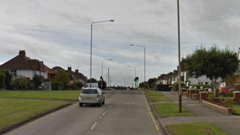 A stretch of road through a residential area