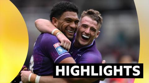 Highlights graphic showing Huddersfield Giants player George Flanagan celebrating with team-mate Taane Milne