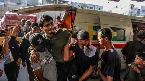  Injured Palestinians are being brought to the Nasser Hospital for their treatment process after Israeli soldiers opened fire at Palestinians trying to reach the points where US aid is distributed west of Rafah city in the southern Gaza Strip, in Khan Yunis, Gaza 