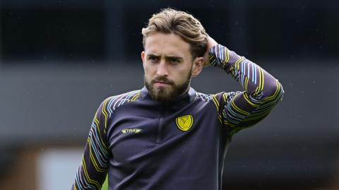 Head shot of Jack Cooper Love warming up in his Burton Albion training top