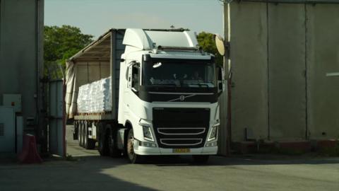 A lorry carrying humanitarian aid for Gaza enters an inspection area at the Israeli-controlled Kerem Shalom crossing with Gaza
