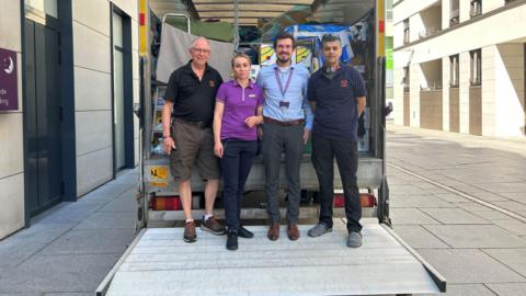 Charles Storer of Hope and Aid Direct with staff from Premier Inn and Ifty Hassan, a driver for the charity 