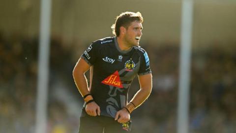 Sam Maunder looks on