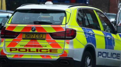 Merseyside Police car in full livery on a street