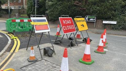 Road closed sign in front of cones on Upper Grosvenor Road in Tunbridge Wells