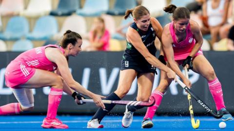 Ireland’s Katie Mullan battles for possession against Germany