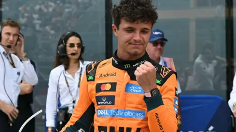 McLaren's Lando Norris clenches his fist in celebration after winning the Miami Grand Prix sprint race