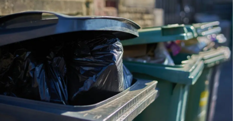 A stock image of three bins, with the black bin at the front the most visible. 