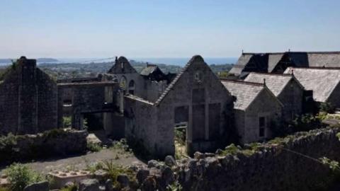 The former Carclaze school pictured after a fire left the building gutted in 2020