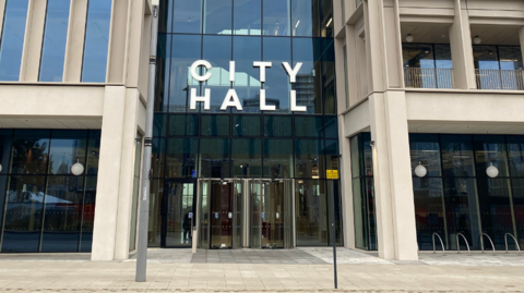 Exterior of Sunderland City Hall, a tall glass and concrete building.