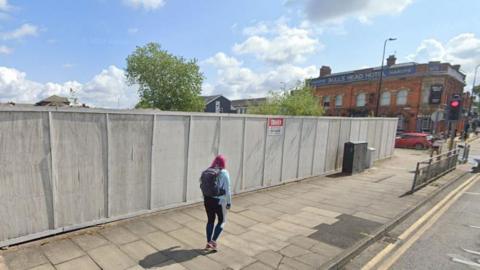 Wooden boards along the pavement where the magistrate's court used to be