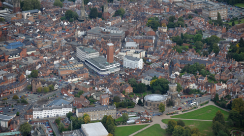 Shrewsbury from the air with a number of buildings with a park in the foreground