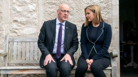 Scottish National Party Leader John Swinney and cabinet secretary Mairi McAllan