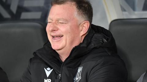 Stoke City Mark Robins enjoys a rib-tickling moment