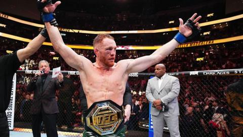 Jack Maddalena has his arm raised after winning the UFC welterweight championship against Belal Muhammad