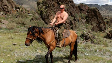 Vladimir Putin photographed topless on horseback in Siberia in 2009