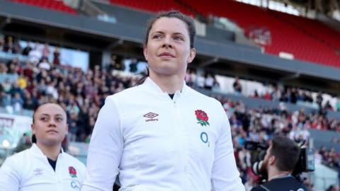 Abbie Ward wearing an England jacket