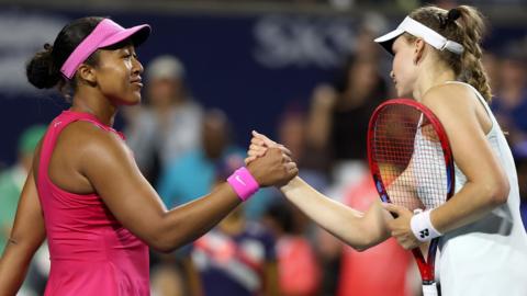 Naomi Osaka and Elena Rybakina clasp hands at the net
