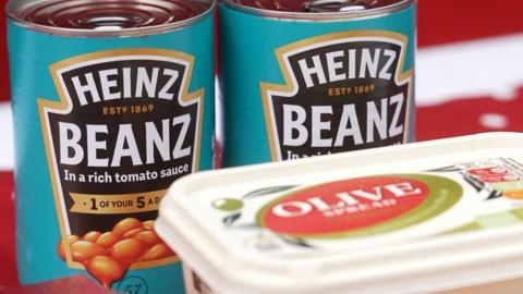 Two cans of Heinz Beanz and an Olive spread