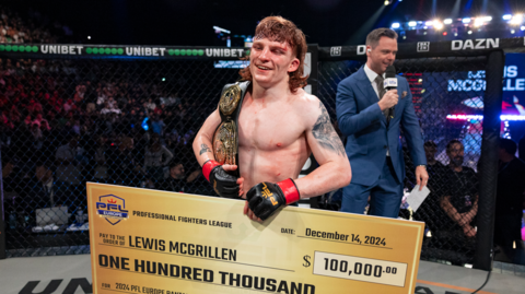 Lewis McGrillen celebrates after beating Alexander Luster for the PFL Europe bantamweight title