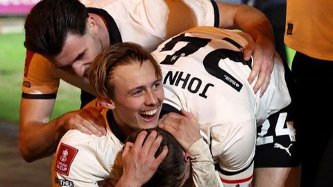 Port Vale players celebrate with goalscorer Ben Waine