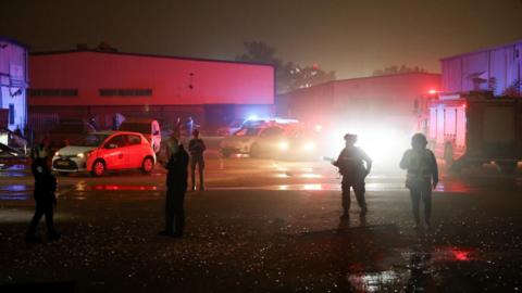 Emergency personnel work at the site of damage after a barrage of Iranian missiles was launched at Israel.