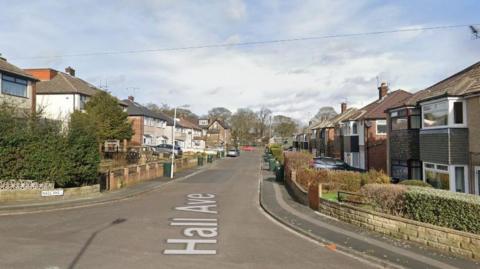 Hall Avenue in Bradford. Houses line either side of the road.