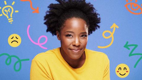 Kimberley Wilson, wearing a yellow t-shirt, looking at the camera