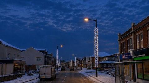 Proposed columns of festive blue and white lights
