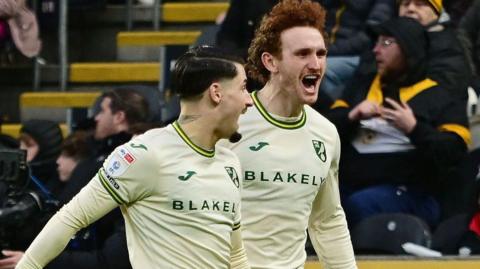 Josh Sargent (right) leads the celebrations for Norwich City against Hull City after his second-half equaliser