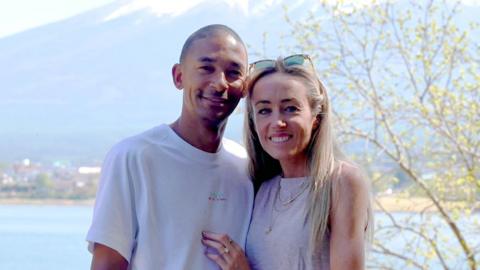 Michael Rimmer and Eilish McColgan smile while looking into the camera, shortly after getting engaged.