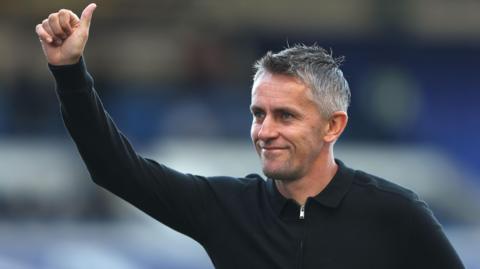 Kieran McKenna gives Ipswich fans a thumbs-up at Birmingham ahead of kick-off