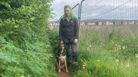 Jess Pinn on the footpath with her dog Nina