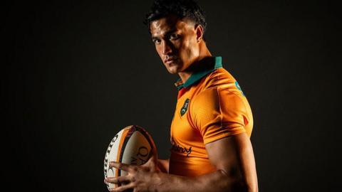 Australia's Joseph Suaalii poses with a rugby ball in hand