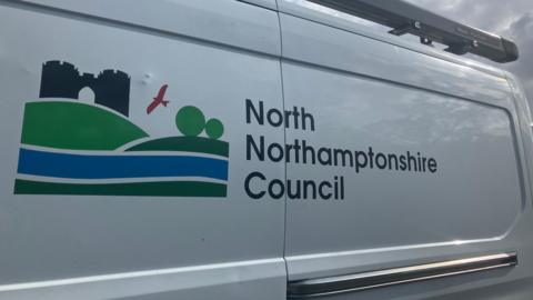 A white van with a North Northamptonshire Council logo.