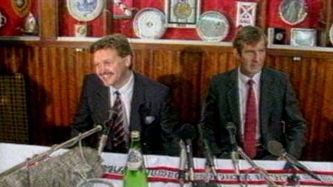 Michael Knighton and another man at a press conference about the Man United deal