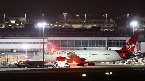 A Virgin Atlantic plane in the dark