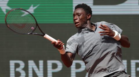 Moise Kouame hits a forehand