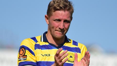 Dean Moxey applauds the Torquay fans