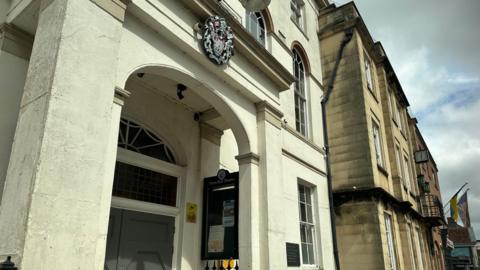 The entrance to Bridgwater Town Council's headquarters - a white building with a small archway