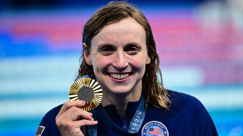 Katie Ledecky with her ninth Olympic gold medal