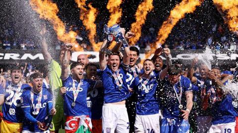 Dara O'Shea of Ipswich Town lifts the Championship runners up trophy