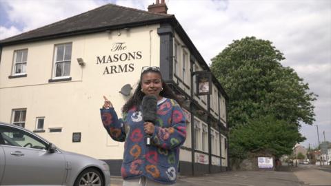 BBC reporter Lena-Zaharah Mohammed stands outside the Mason Arms 