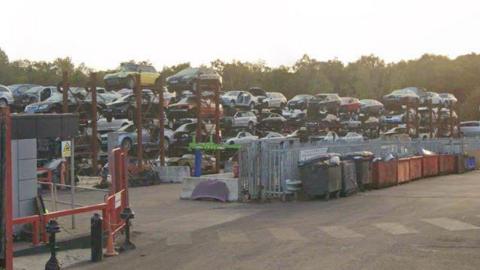 A1 Group's scrapyard in Barkham - hundreds of scrap cars can be seen. 