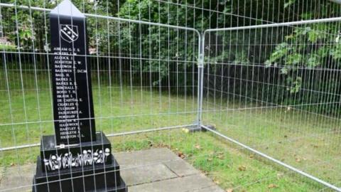 Fenced off black marble war memorial in Scarisbrick