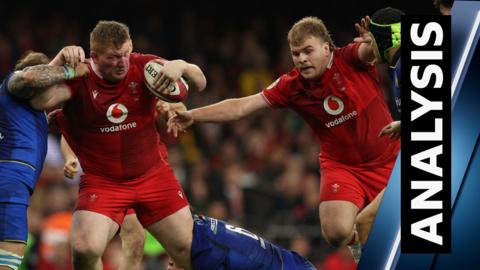 Wales' Rhys Carre fends off a tackle from an Italian player