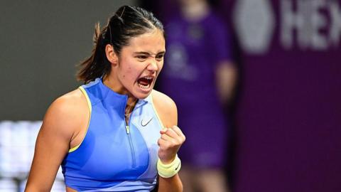 Emma Raducanu celebrating on a tennis court