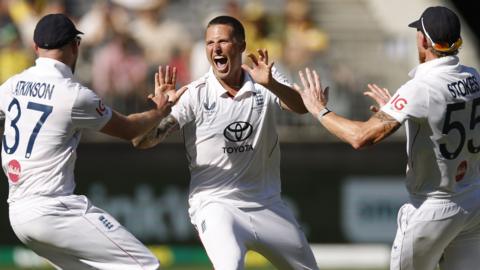 Brydon Carse celebrates a wicket with Gus Atkinson and Ben Stokes