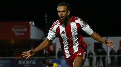 Danny Waldron celebrates a Brackley Town goal against Woking