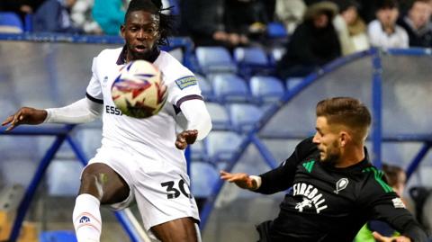 Tranmere Rovers' Omari Patrick takes on Salford City's Luke Garbutt